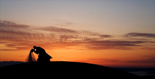 wedding photo by J Garner Photography, beautiful sunset, silhouette, bride and groom